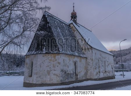 Blue Cloudy Morning With Fog And Church In Loucovice Village