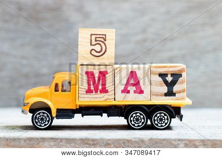 Truck Hold Letter Block In Word 5may On Wood Background (concept For Date 5 Month May)