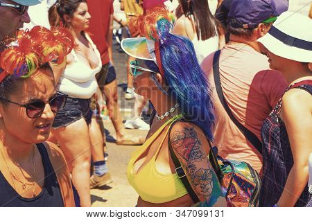 The Annual Parade Lgbt. Lesbians Walking In The Gay Pride Parade. Parade Of Tolerance. Rainbow Flags