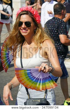 The Annual Parade Lgbt. Lesbian Walking In The Gay Pride Parade. Parade Of Tolerance. Rainbow Flags 