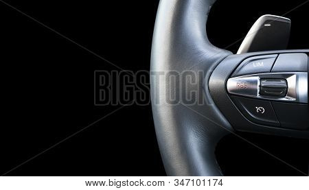 Modern Car Interior. Steering Wheel With Media Phone Control Buttons Isolated On Black Background. C