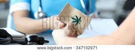 Female Doctor Writes Prescription For Medical Marijuana To Patient In Hospital Office. Legal Marijua