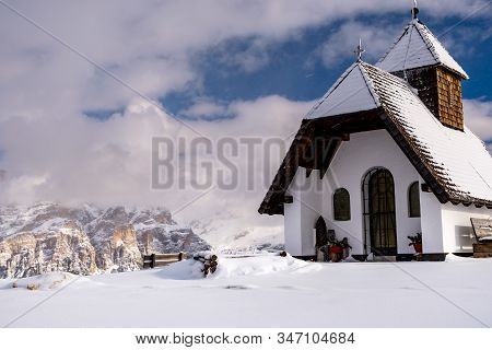 An Old Church On The Top Of The Mountain In Italian Alps During Winter Season