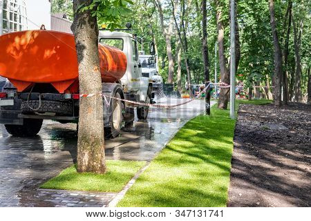 Straigh Line Border Of New Freshly Installed Green Rolled Lawn Grass Border With Dirt Soil Prepared 