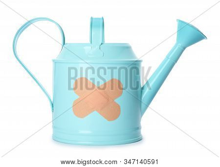 Light Blue Watering Can With Sticking Plasters Isolated On White