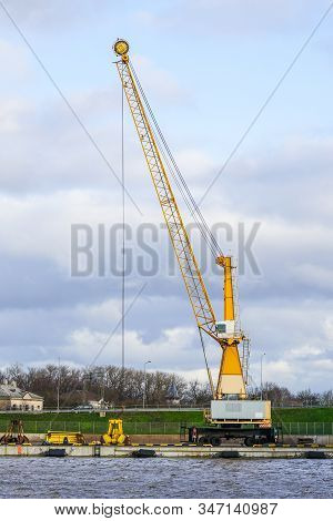 A Large Waterbed Dredger On The Side Of The Canal