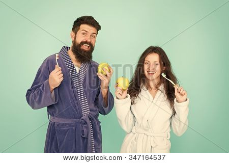 Morning Routine. Personal Care And Hygiene. Feeling Happiness. Couple In Bathrobe Clening Teeth. Man