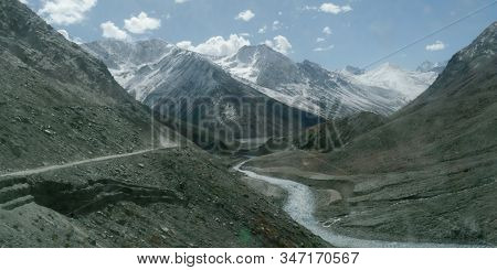 V-shaped Himalayas Valley Down Which A River With A Winding Course Flows. An Interlocking Overlappin