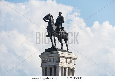 Statue Of General Maximo Gomez Against A Blue Cloudy Sky. Maximo Gomez Is One Of The Leaders Of The 