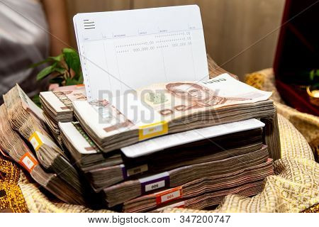 One Thousand Baht Banknotes Money Stack And Bank Book Showing Deposit Money On Golden Tray Used As W