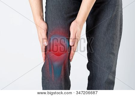 Knee Pain, Man With Legs Ache, Chiropractic Treatments Concept On Gray Background