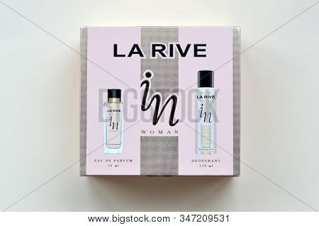 La Rive In Woman Deodorant And Perfume Bottles In Brand Box On Beige Background. La Rive S.a. Is One
