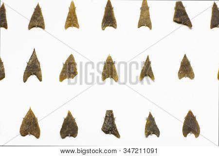 Malaga, Spain - Sept 21th, 2018: Multiple Silex Arrowheads. Early Copper Age. Malaga Museum