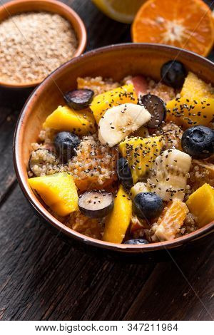 Quinoa Bowl Of Dish. Fresh Quinoa Organic Fruit Salad In Bowl On Wooden  Background. Helthy Superfoo