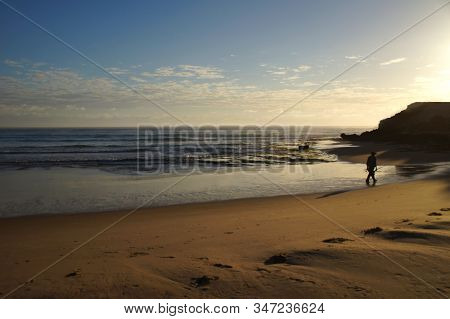 Fisherman Walking To Work In The Early Morning In Mozambique