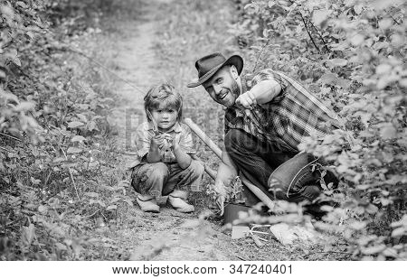 Day Of Earth. Boy And Father In Nature. Gardening Tools. Planting Flowers. Dad Teaching Little Son C