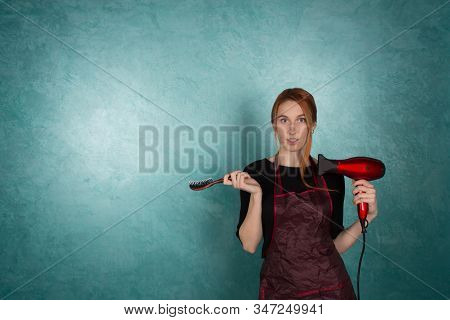 Smiling Girl Hairdresser Holds Fan And Scissors In Hands