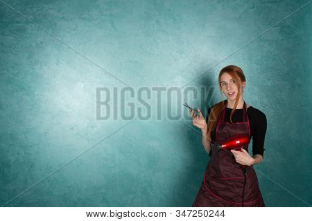 Girl Hairdresser Holds Fan And Scissors In Hands