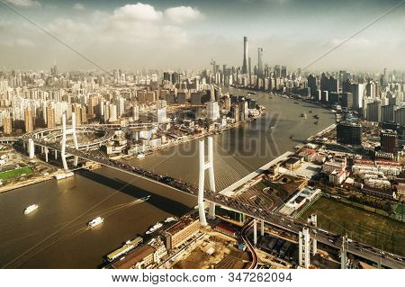 Shanghai Nanpu Bridge over Huangpu River with busy traffic in China.