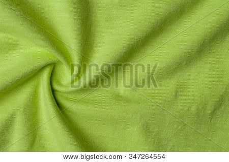 Close-up Fragment Of Crumpled Beautiful Yellow Cotton Fabric. Concept Of High-quality Raw Materials 