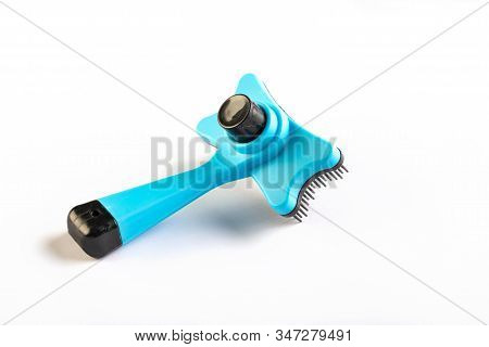 Pets Comb With Button For Cleaning On White Background