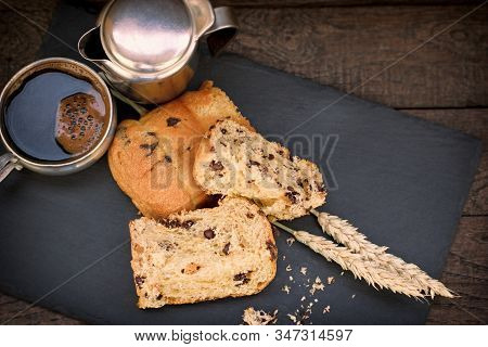 Delicious Meal, Panettone And Black Coffee On Plate