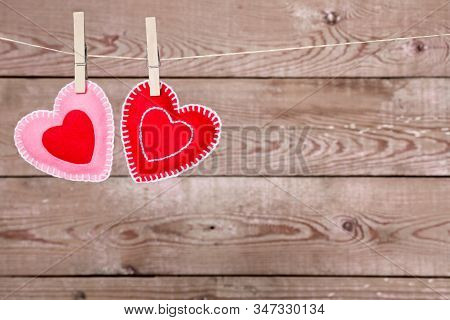 A Clothesline With Cute Valentines Day Hearts Decorations On A Rustic Background Great