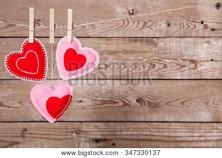 A Clothesline With Cute Valentines Day Hearts Decorations On A Rustic Background Good