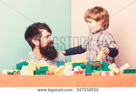 Happy Family. Leisure Time. Little Boy With Bearded Man Dad Playing Together. Child Development. Bui