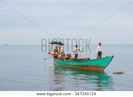 KAMPOT, CAMBODIA - CIRCA NOVEMBER 2019: Cambodian fishermen going to the daily fishing circa November 2019 in Kampot city, Cambodia. Kampot is the popular tourists destination.