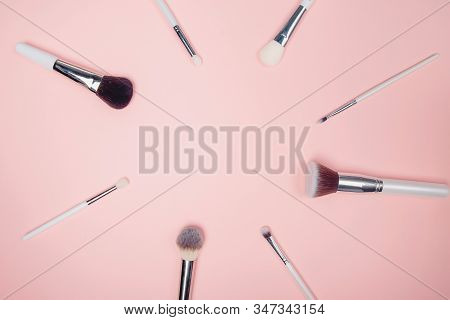 Set Kit Makeup Brushes On Pink Background, Flat Lay Top View