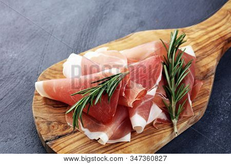 Dry Spanish Ham, Jamon Serrano, Bellota, Italian Prosciutto Crudo Or Parma Ham. Meat Cutting