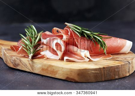 Dry Spanish Ham, Jamon Serrano, Bellota, Italian Prosciutto Crudo Or Parma Ham. Meat Cutting