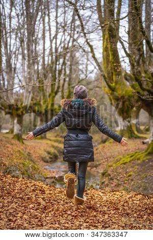 A Young Girl In The Otzarreta Forest In The Natural Park Of Gorbea, Bizkaia. Basque Country