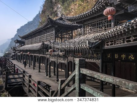 Yichang, Hubei / China - Dec 25 2019:  The Wooden Village Along With The Hill Beside The Yangtze Riv
