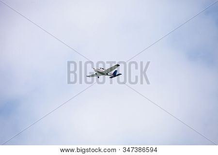Small Cessna 172 Airplane Soars Through Blue Sky Over The Southwestern Part Of Florida.