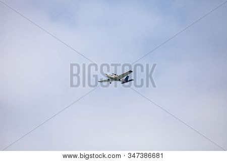 Small Cessna 172 Airplane Soars Through Blue Sky Over The Southwestern Part Of Florida.