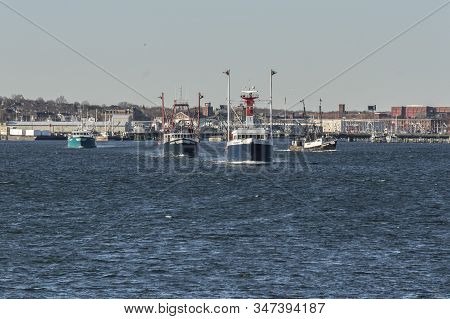 New Bedford, Massachusetts, Usa - January 20, 2020: Commercial Fishing Boats Crossing New Bedford In