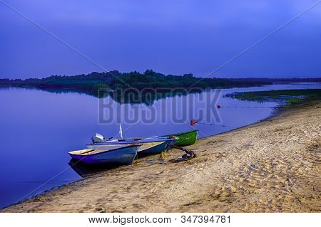 Motorboats Moored At Sandy Shore Of The Peaceful Pripyat River. River Is A Part Of National Rivers R