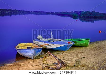 Motorboats Moored At Sandy Shore Of The Peaceful Pripyat River. River Is A Part Of National Rivers R