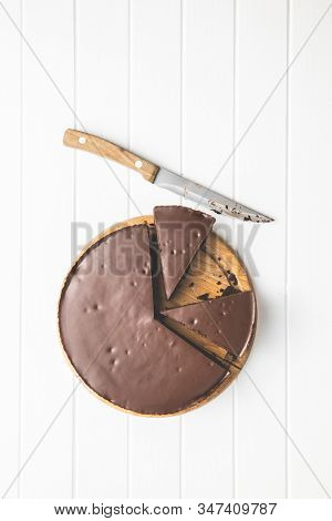 Chocolate brownies cake on white table.