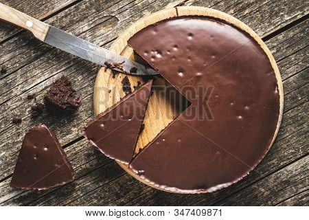 Chocolate brownies cake on wooden cutting board.