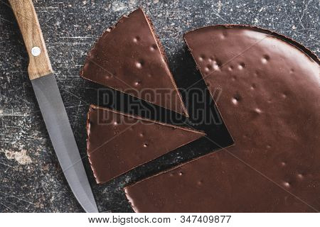 Chocolate brownies cake on old kitchen table.