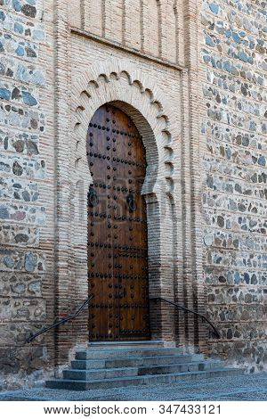 Horseshoe Arch Door In Santiago Del Arrabal Church In Toledo, Spain. Built In Mudejar Style