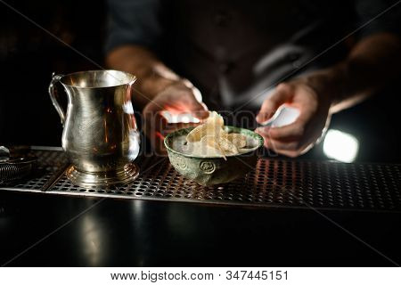 Bartender Holding A Deep Plate With The Long Toothpick With The Dried Sugar Pinepple Slices