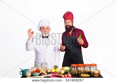Chef. Two Chefs On Kitchen. Healthy Food. Professional Culinary. Bearded Man In Kitchen Apron. Beard