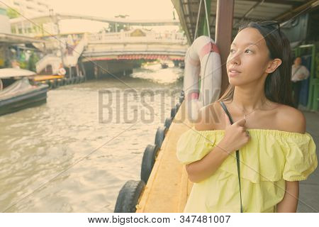 Young Beautiful Tourist Woman Exploring The City
