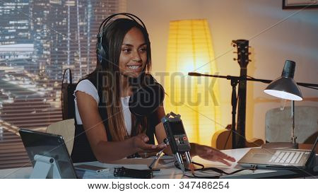 Close-up Of Female Radio News Reporter Recording Her Morning Speech In Home Studio, Working In The E