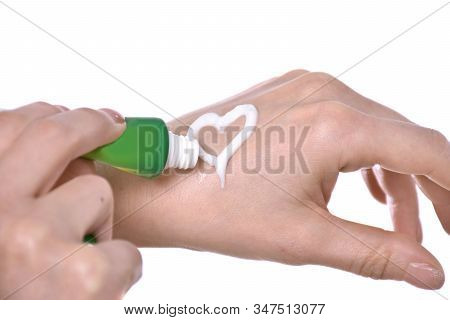 Closeup Shot Of Beautiful Female Hands  Applying Moisturiser