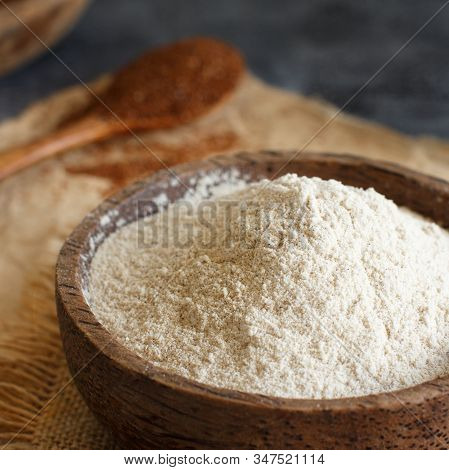 Teff Flour In A Bowl And Teff Grain With A Spoon Close Up